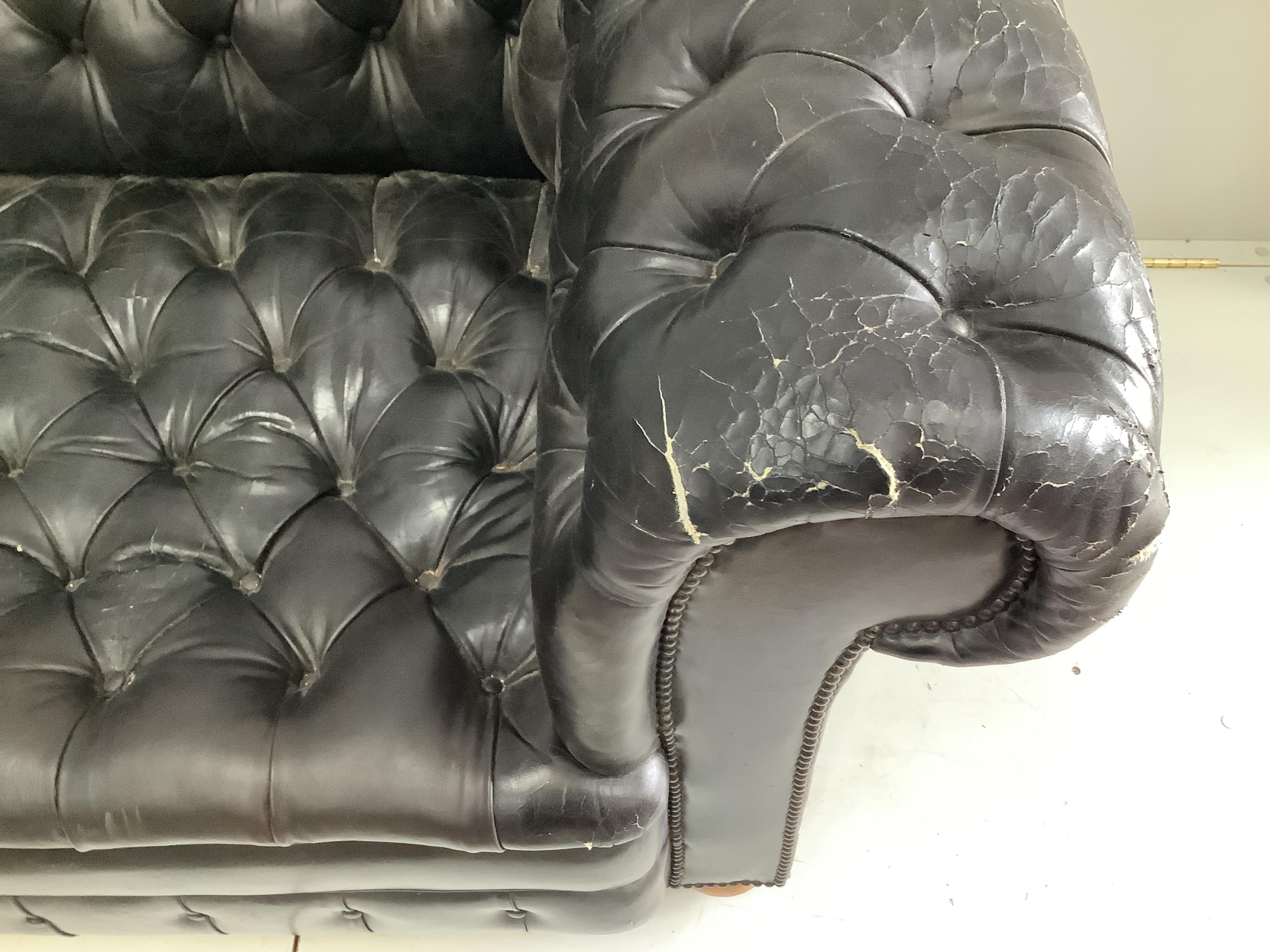 A Victorian style black leather button back chesterfield settee, width 230cm, depth 90cm, height 73cm. Condition - poor